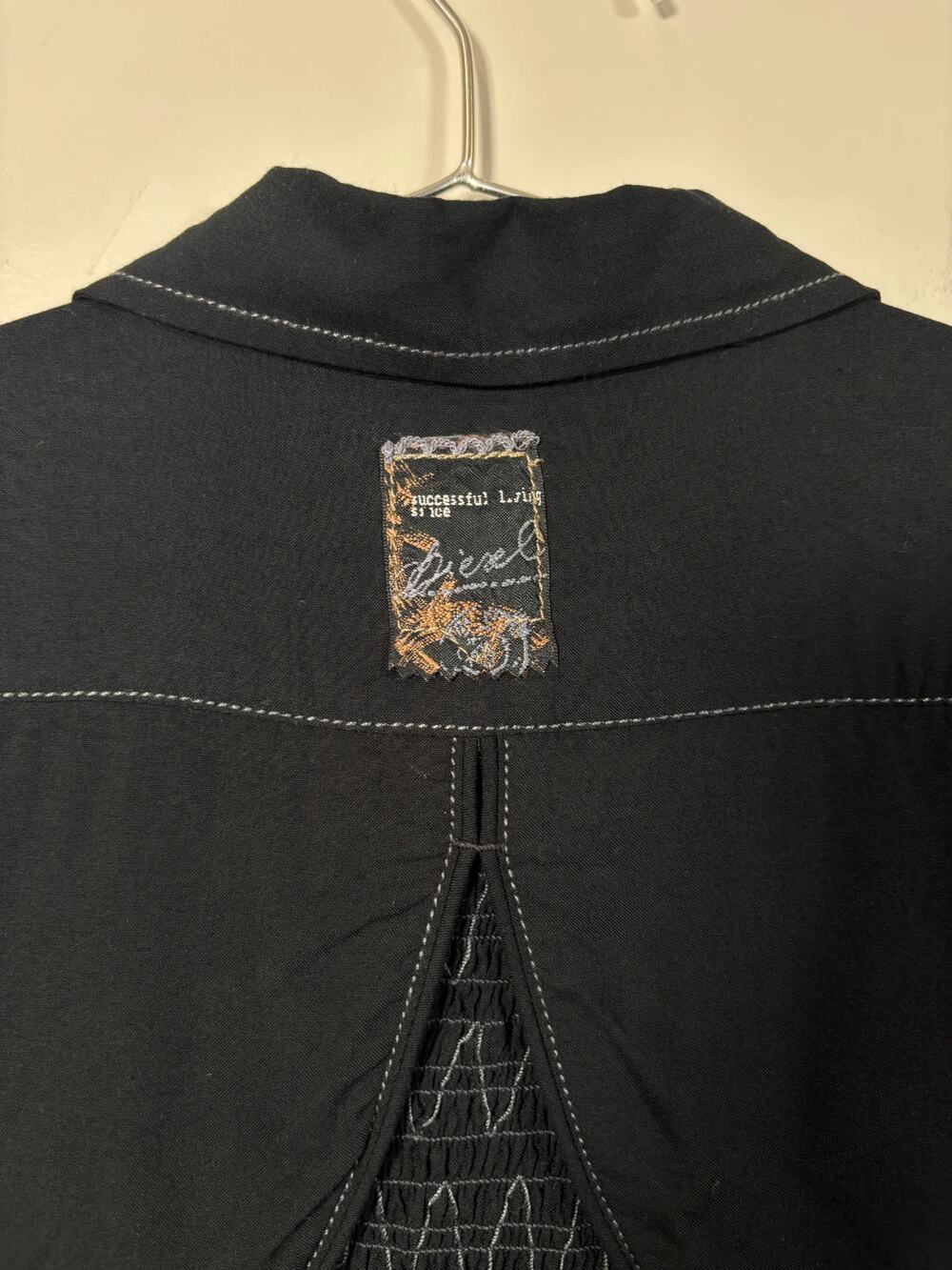 Diesel black viscose blouse with short sleeves, button front placket, smocked pa